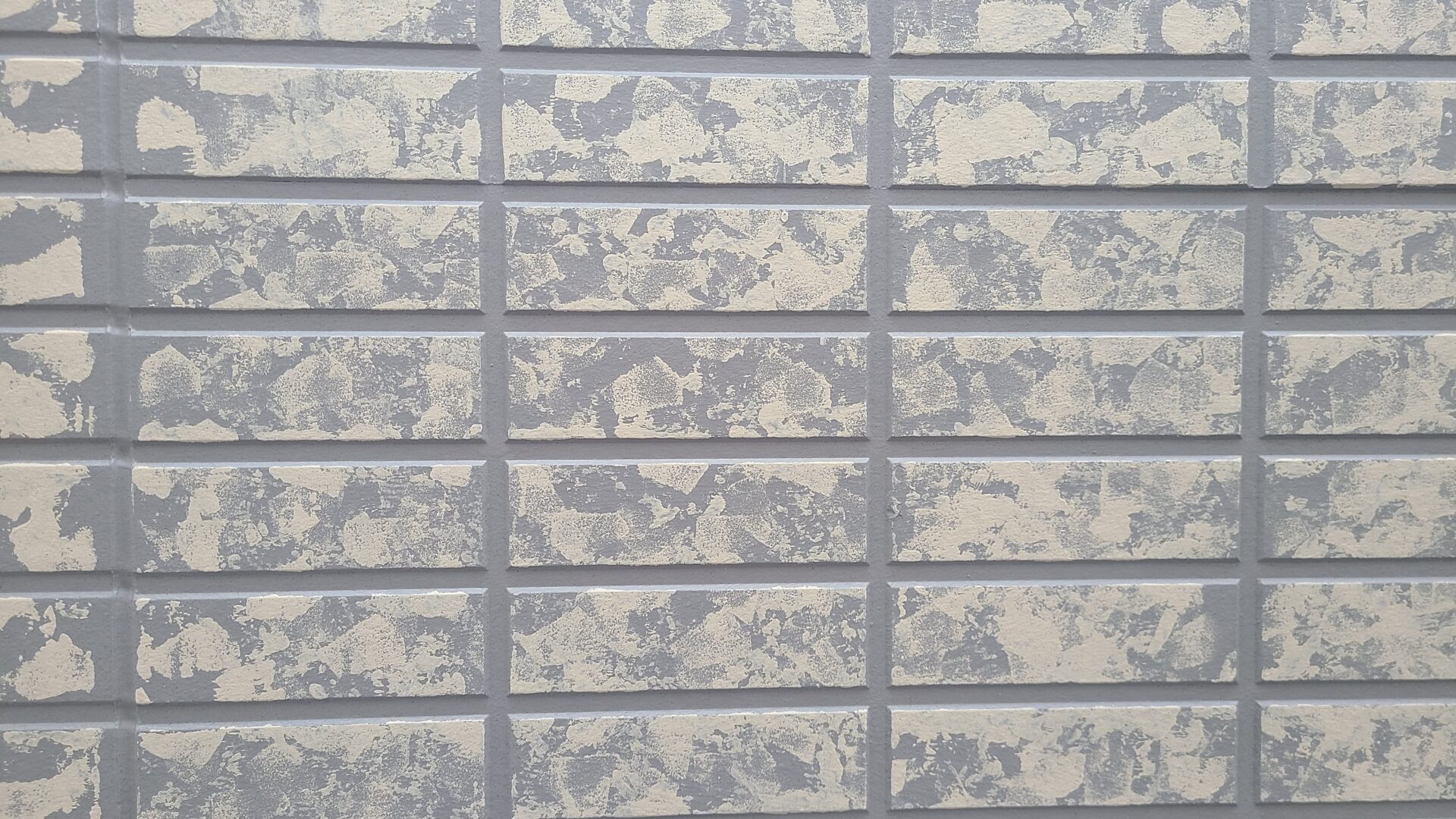 多彩色工法による外壁の仕上げ